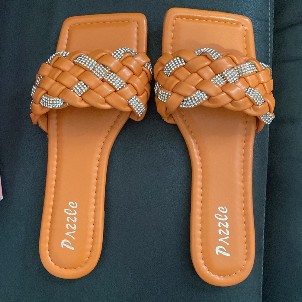 I’m selling these cute orange with bling accents summer flats. Never worn